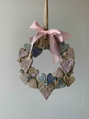 Sweet Pastel Ceramic Heart wreath on jute ribbon with added silk bow.